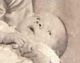 Florence Piper with baby Flopsie in her Christening dress